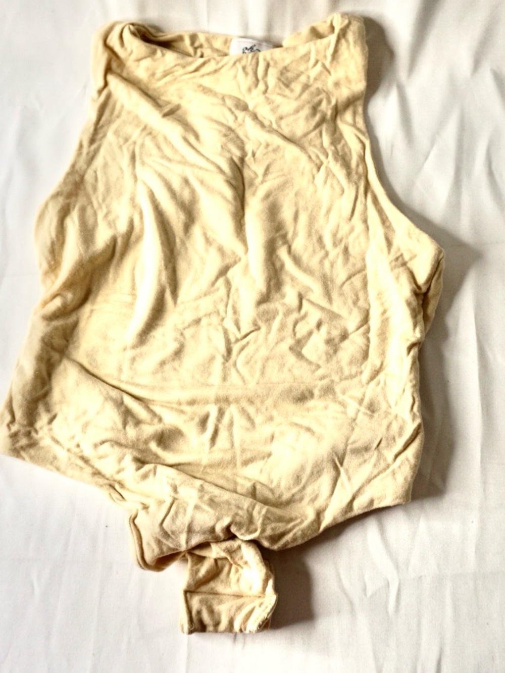Sleeveless Knot-Front Bodysuit in Light Cream